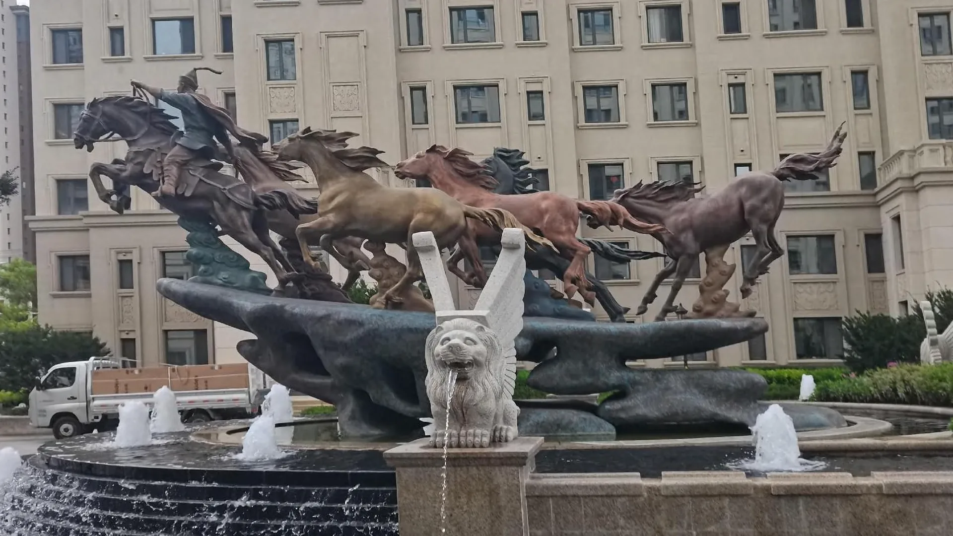 Completed bronze horse group sculpture installed in a fountain